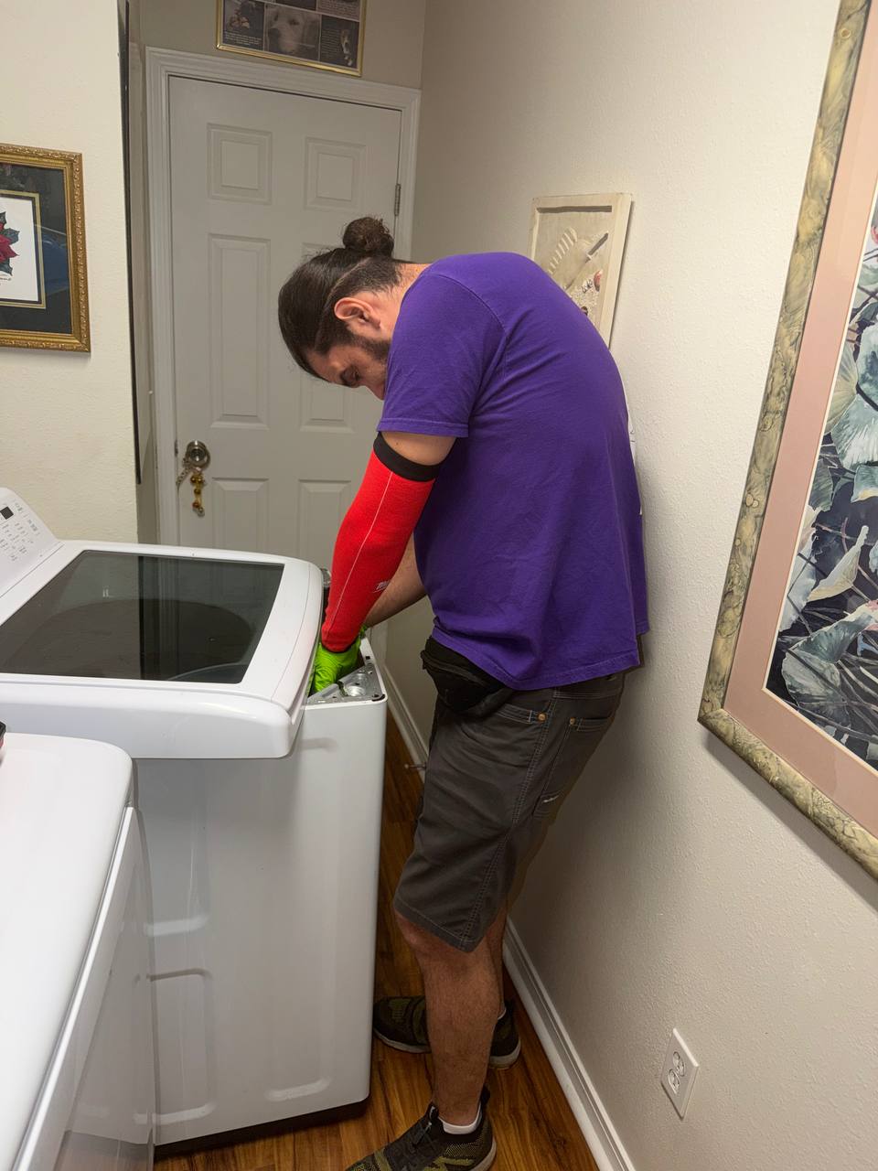 Technician inspecting an appliance in Jacksonville